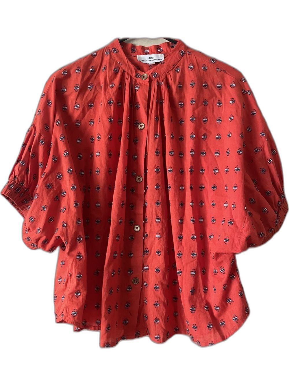 Never A Wallflower red blouse. Size Small. In geometric print button-front.
